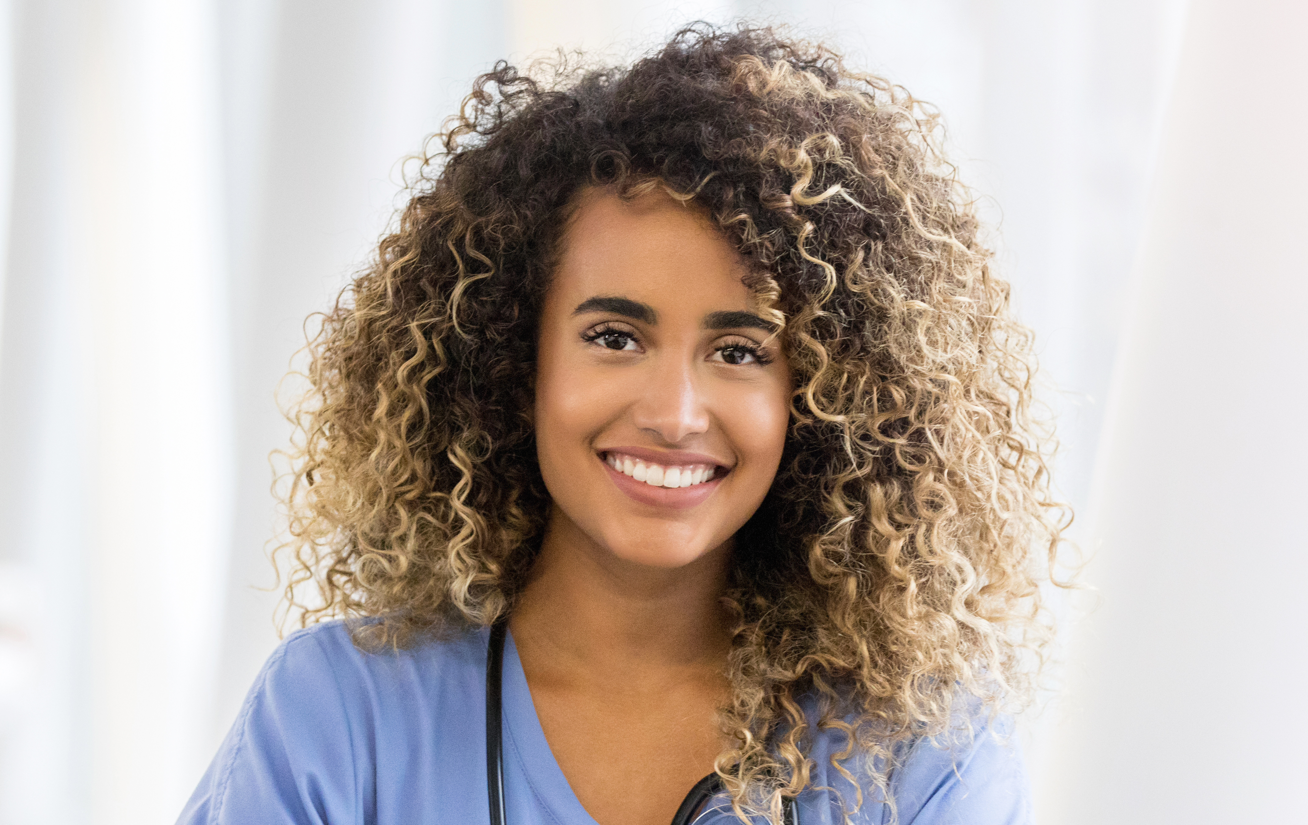 Portrait of confident female nurse - stock photo