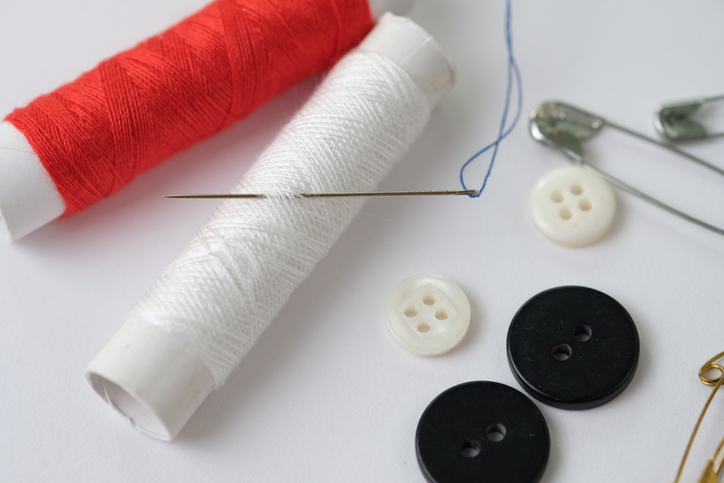 Close-Up Of Sewing Items On White Background