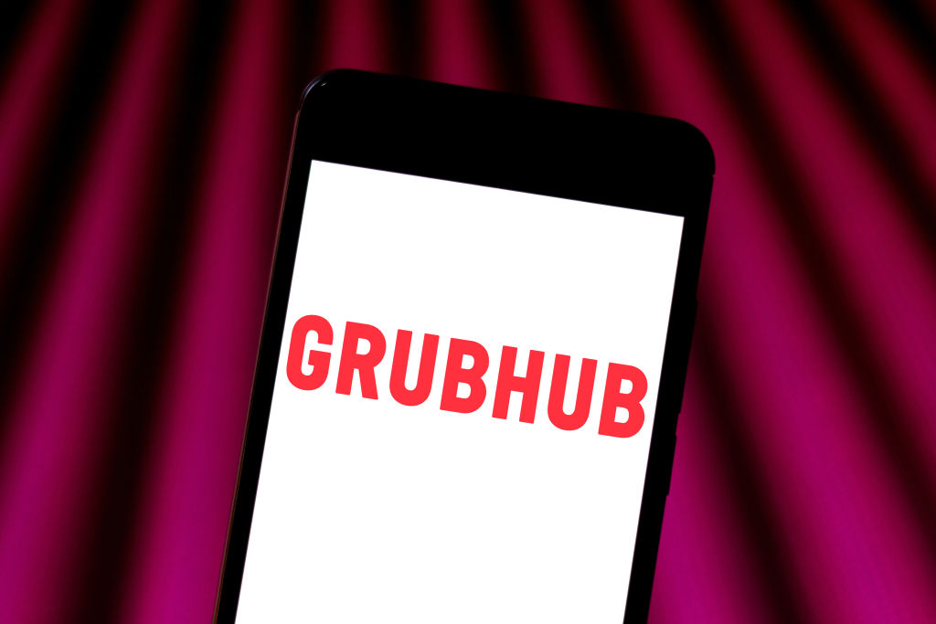 In this photo illustration a Grubhub logo seen displayed on...