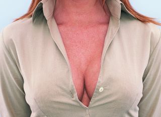 Mid Section View of a Young Businesswoman's Cleavage