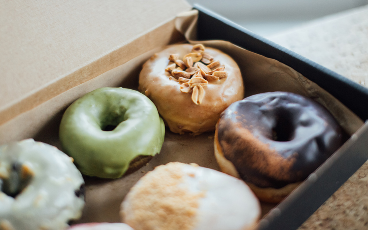 Close-up Shot Of A Box Of Delicious Crafted Donuts For Sharing