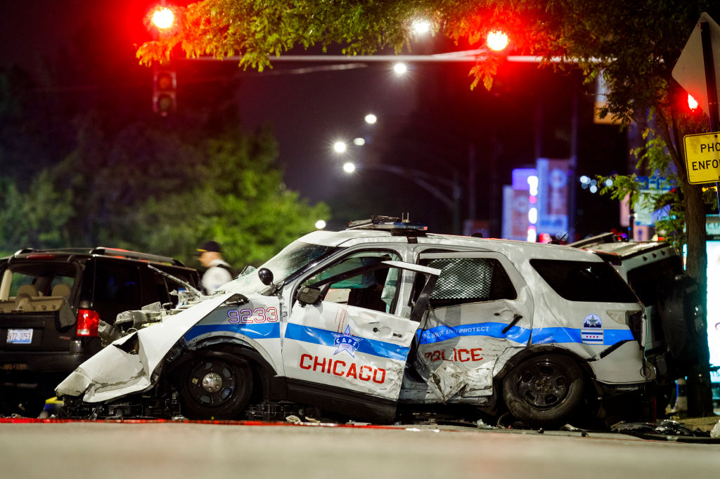 Chicago police car crashes into SUV, killing driver, while chasing suspect wanted for homicide and several shootings