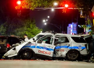 Chicago police car crashes into SUV, killing driver, while chasing suspect wanted for homicide and several shootings