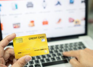 man using credit card for online shoping