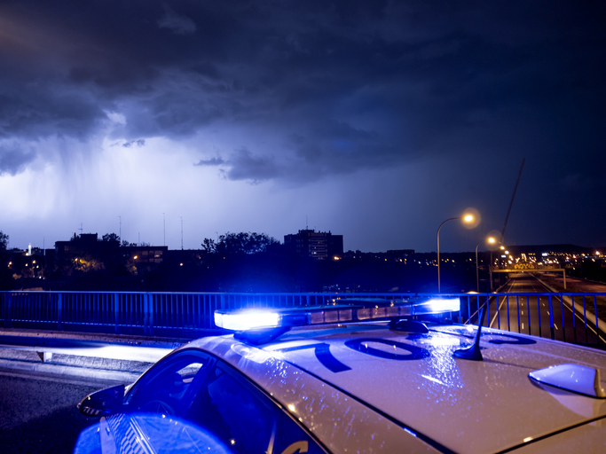 Spain, Madrid,Close-upof police emergency lights glowing during night intervention