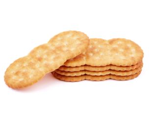 Stack of Delicious salty crackers isolated on white background