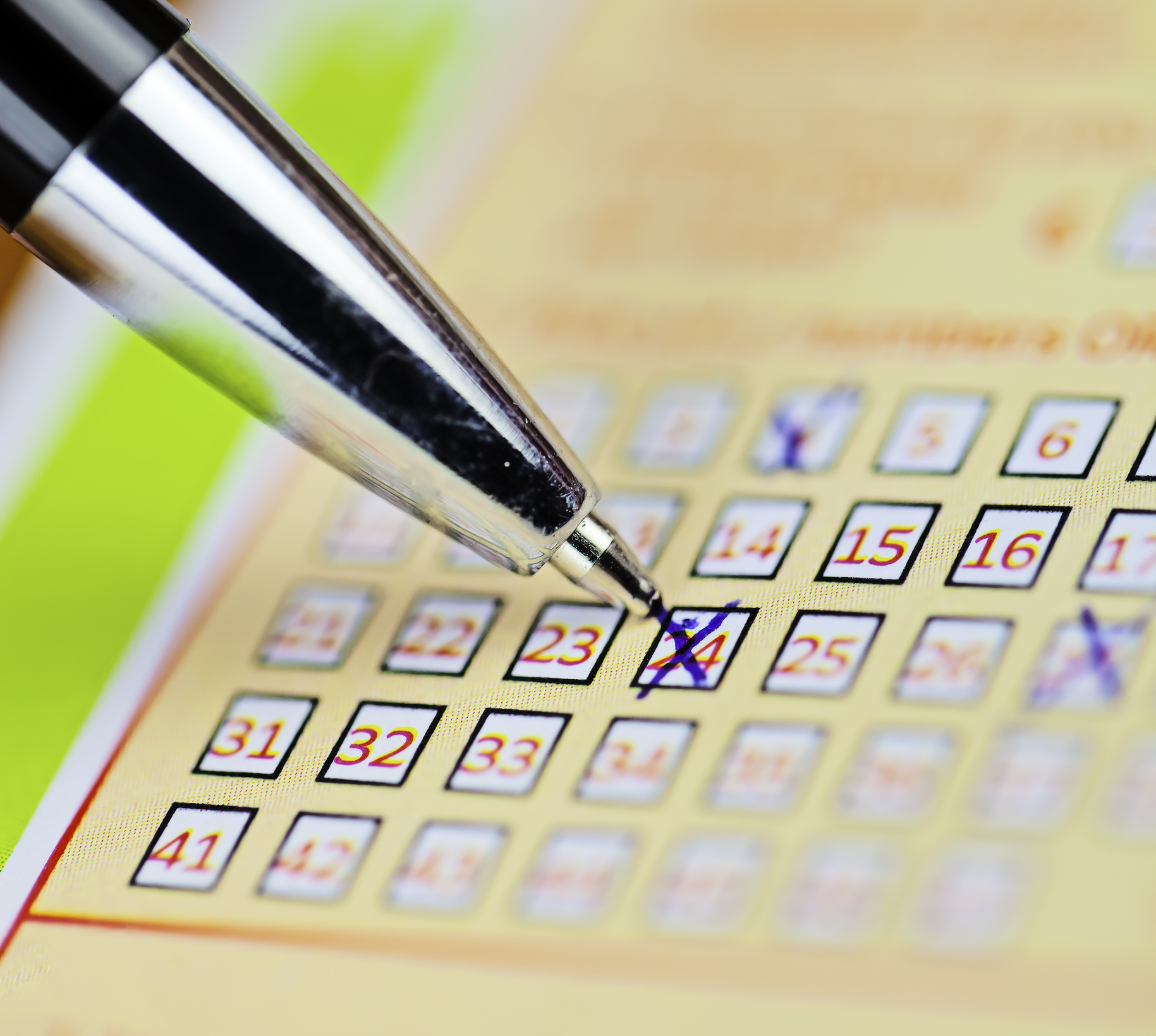 Pen markings on lottery ticket. Filled in lottery ticket