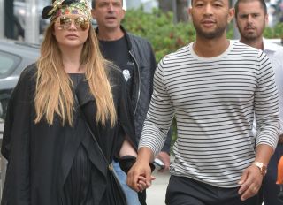 Chrissy Teigen and John Legend step out in Beverly Hills smiling and holding hands