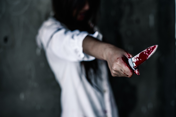Woman Holding Blood Stain Knife