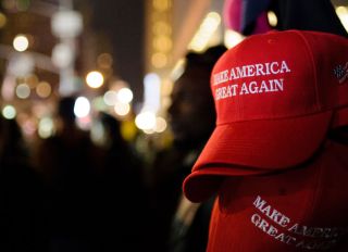 "Make America Great Again" red baseball caps, signature...
