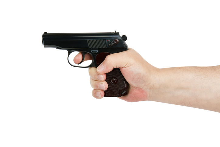 Hand with gun isolated on white background