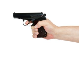 Hand with gun isolated on white background