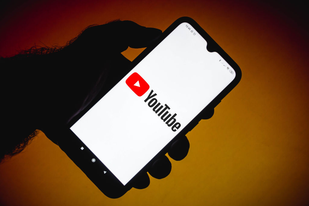 In this photo illustration the YouTube logo seen displayed...