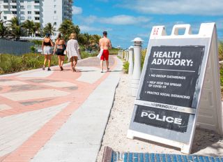 Miami Beach, South Beach, Spring Break closed public beaches sign police warning due to Coronavirus Pandemic