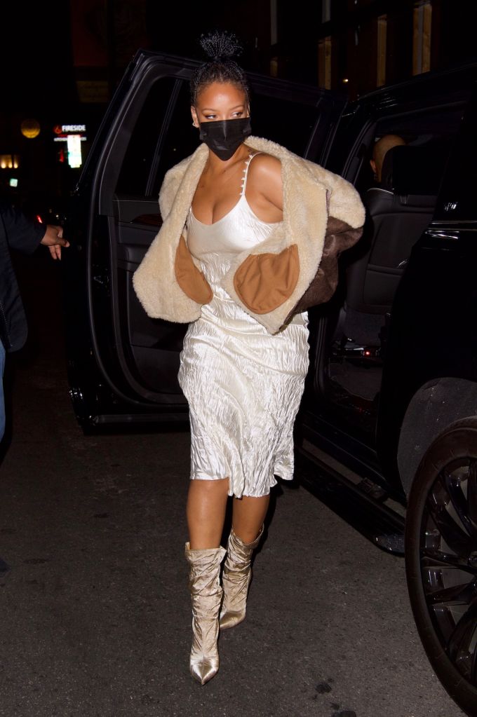 Rihanna wore a cream colored slip dress and natural colored booties for dinner out in Los Angeles