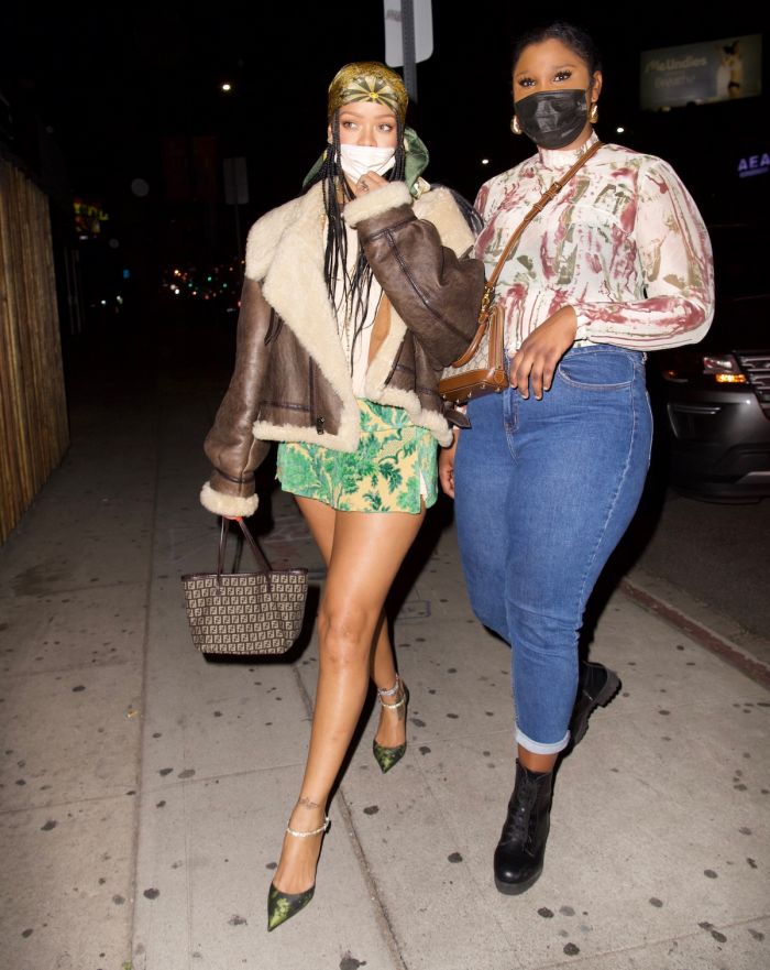 Rihanna hits The Nice Guy with a friend wearing a short skirt and green scarf