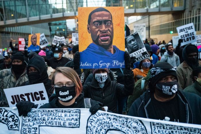 Protesters march around downtown Minneapolis near the courthouse calling for justice for George Flyod after closing arguments in the Chauvin trial has ended