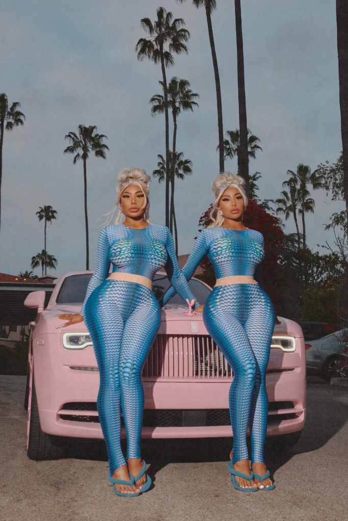 Shannade and Shannon Clermont wear blue jumpsuits pink Rolls Royce