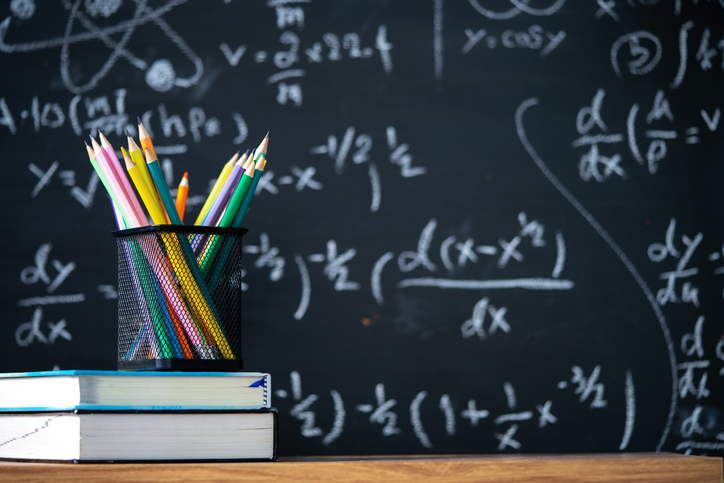 Books and pencils on a classroom table