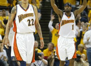 Matt Barnes and Stephen Jackson react to a second half score in game six of the NBA Playoffs at the Oracle in Oakland, California on Thursday, May 3, 2007.(Anda Chu/The Oakland Tribune)