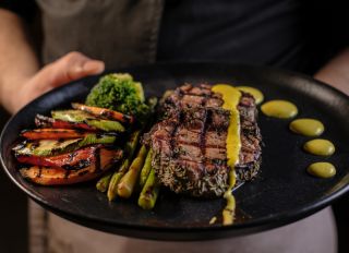 Grilled beef steak with asparagus and vegetables