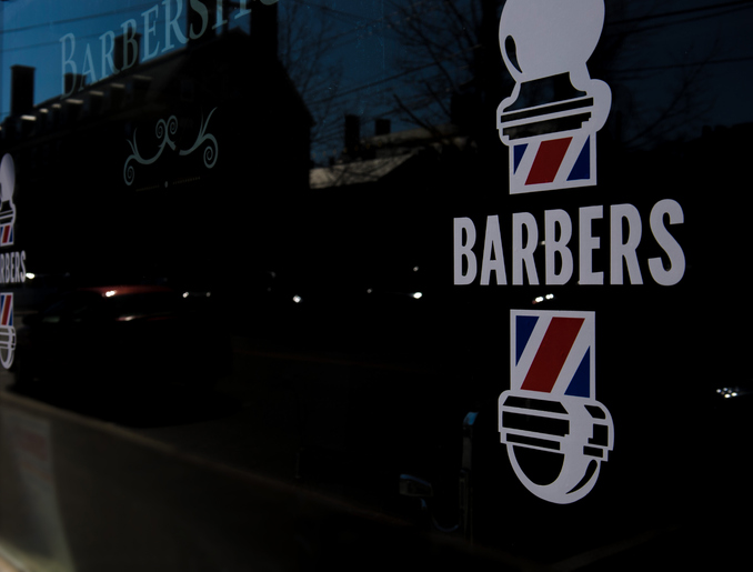 barbershop window front in small town