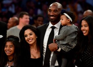 Kobe Bryant poses with his family