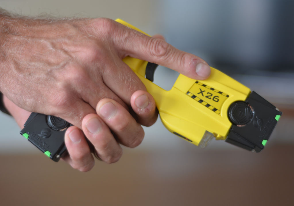 Trooper David Beohm holds his Taser X26 Stun gun. At the State Police Barracks for Troop L. in Reading Tuesday afternoon August 18, 2014, where Trooper David Beohm was showing us his Taser X26 stun gun. Photo by Ben Hasty