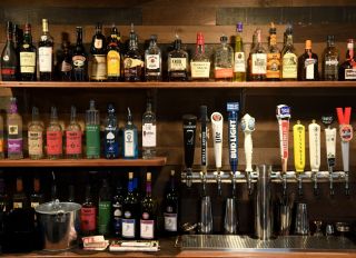 Bottles of liquor and beer taps at the bar. At the Barrel and Ale restaurant and bar in Boyertown Wednesday afternoon October 2, 2019. Photo by Ben Hasty