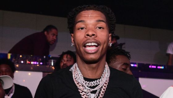 Lil Baby posing with Foot Locker employees after buying out the entire  store to give sneakers away. Lil Baby is planning on giving back to…