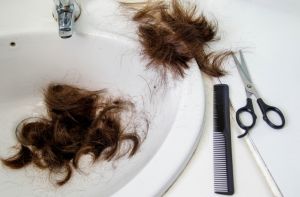 Cut hair in the bathroom sink