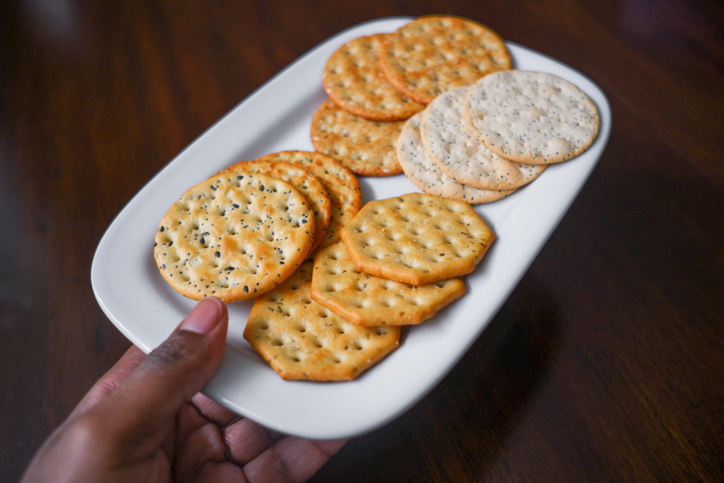 Woman Snacks on Crackers