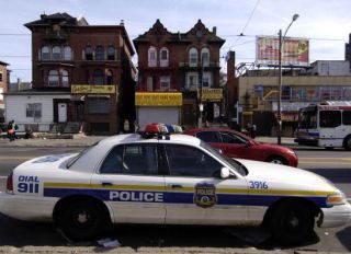 A Philadelphia police patrol car sits parked in North Philad