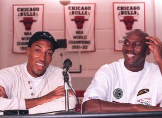 Chicago Bulls basketball stars Michael Jordan (R)