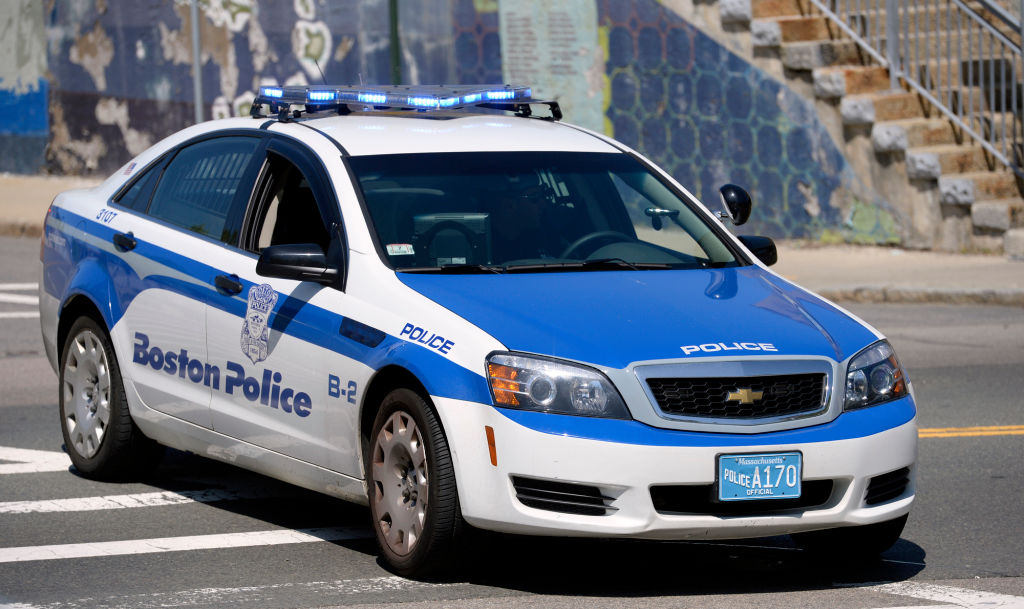 (Boston, MA, 05/21/14) A Boston Police cruiser blocks off Dudley Street as police investigate the scene of a shooting in Boston on Wednesday, May 21, 2014. car squad Staff photo by Christopher Evans.