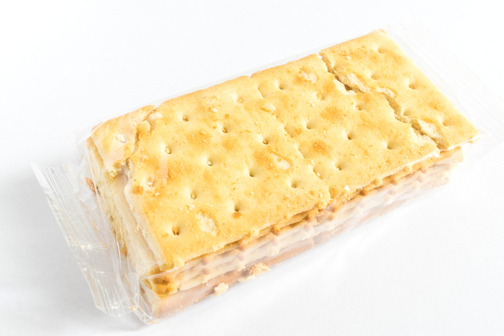 Close-Up Of Cracker Packet Over White Background