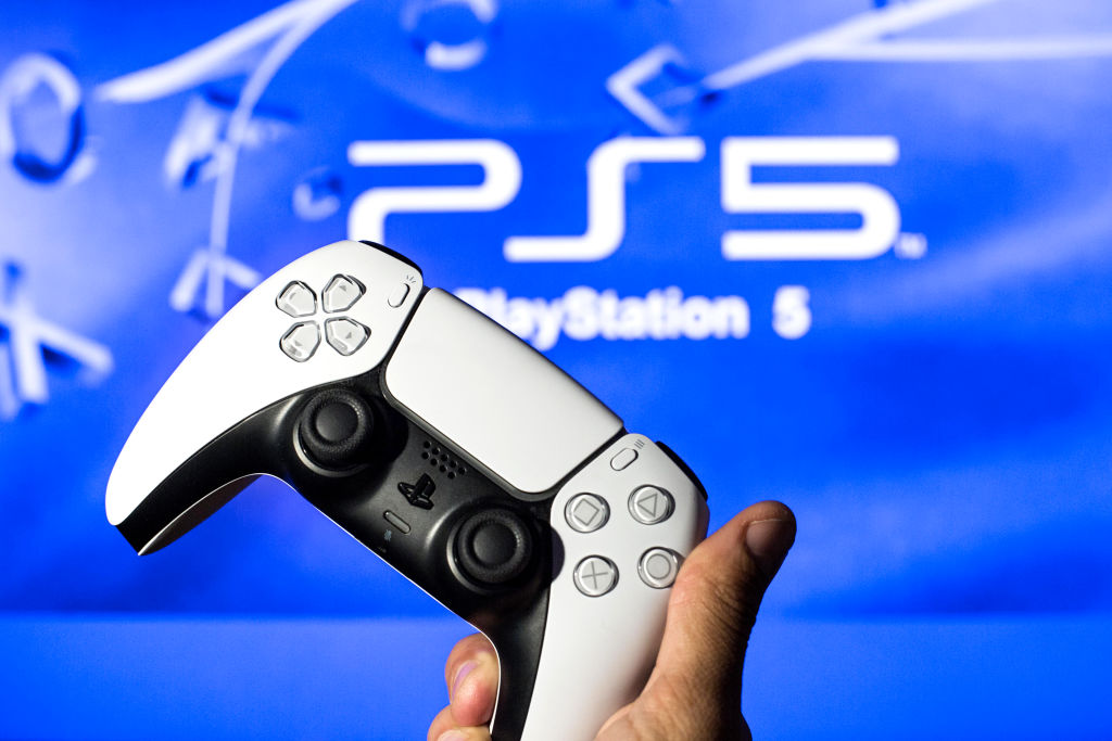 In this photo illustration, a PlayStation 5 controller seen...