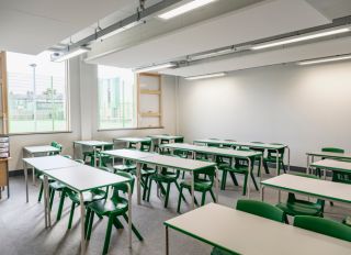 Secondary school classroom with desks and chairs