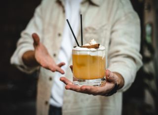 Man holding fresh cocktail
