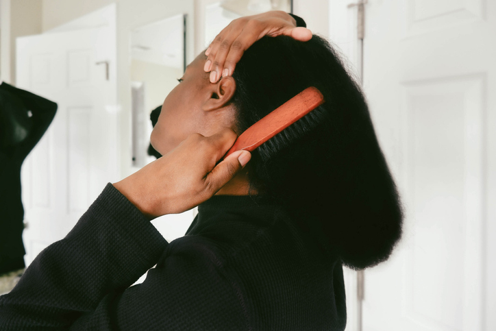 Woman Brushes Her Hair