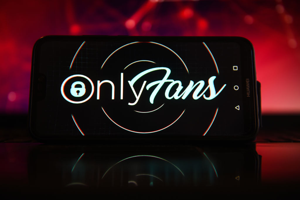 In this photo illustration the OnlyFans logo seen displayed...