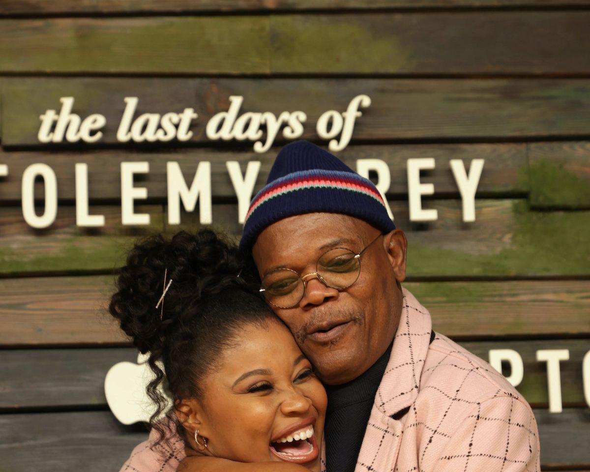Dominique Fishback hugs Samuel L. Jackson at the series premiere of Apple Original limited series “The Last Days of Ptolemy Grey” at The Bruin in Los Angeles, CA, on March 7, 2022. “The Last Days of Ptolemy Grey” premieres on Friday, March 11, 2022 on Appl