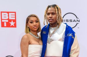 Lil Durk and India Royale pose on the red carpet at the BET Awards 2021 .