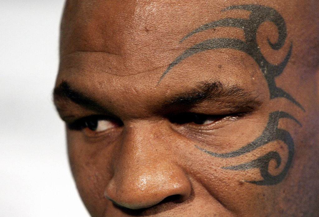 Whoa, Big Fella! A Mike Tyson Stan Pulls Out Gun During Comedy Show While Kissing The Champ’s Brooklyn-Born Backside [Video]