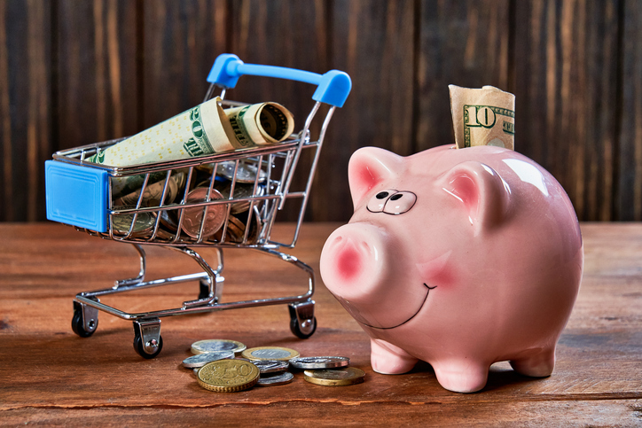 Piggy bank full of dollar bills