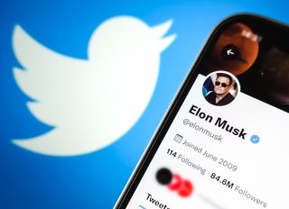 In this photo illustration, Elon Musk's Twitter account is...