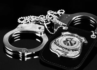 Handcuffs and badge for police enforcement