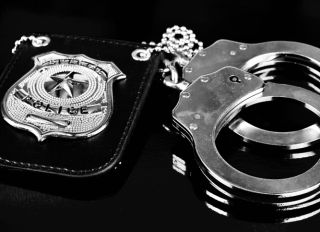 Badge and handcuffs for police duties