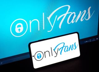 In this photo illustration, the OnlyFans logo seen displayed...