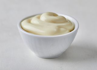 Mayonnaise in a small ceramic bowl